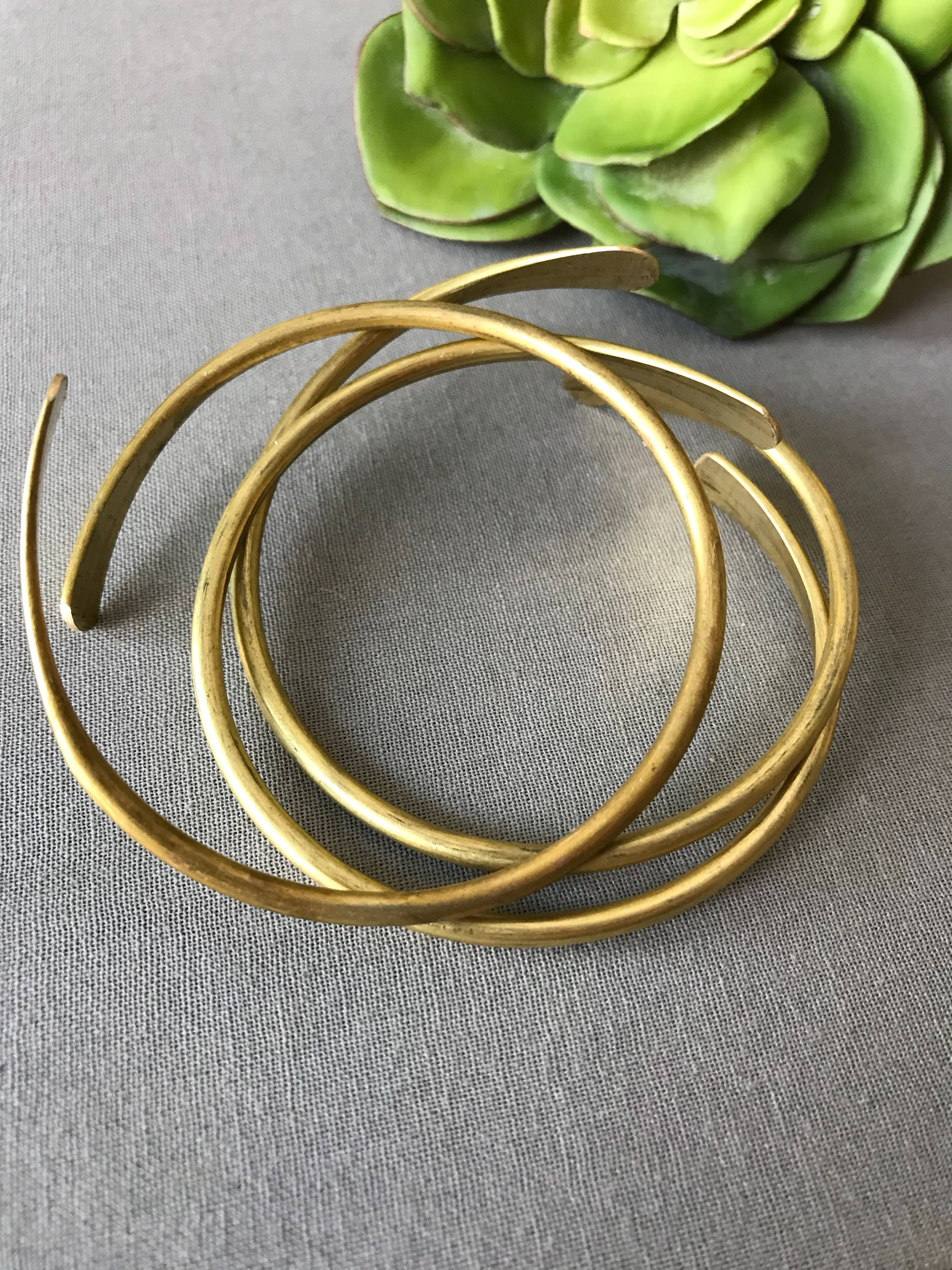 The Coil Brass Bangle (not sold in sets)